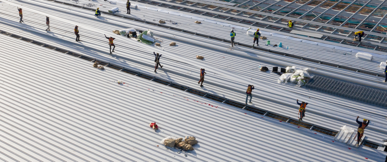 Construction Worker Wearing Ppe Woking At Roof