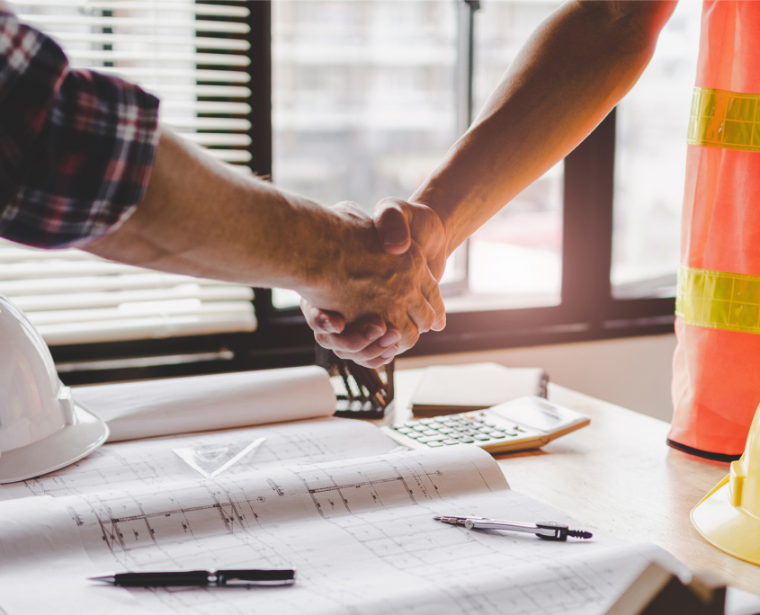 Construction Worker Team Hands Shaking After Consultation Meeting
