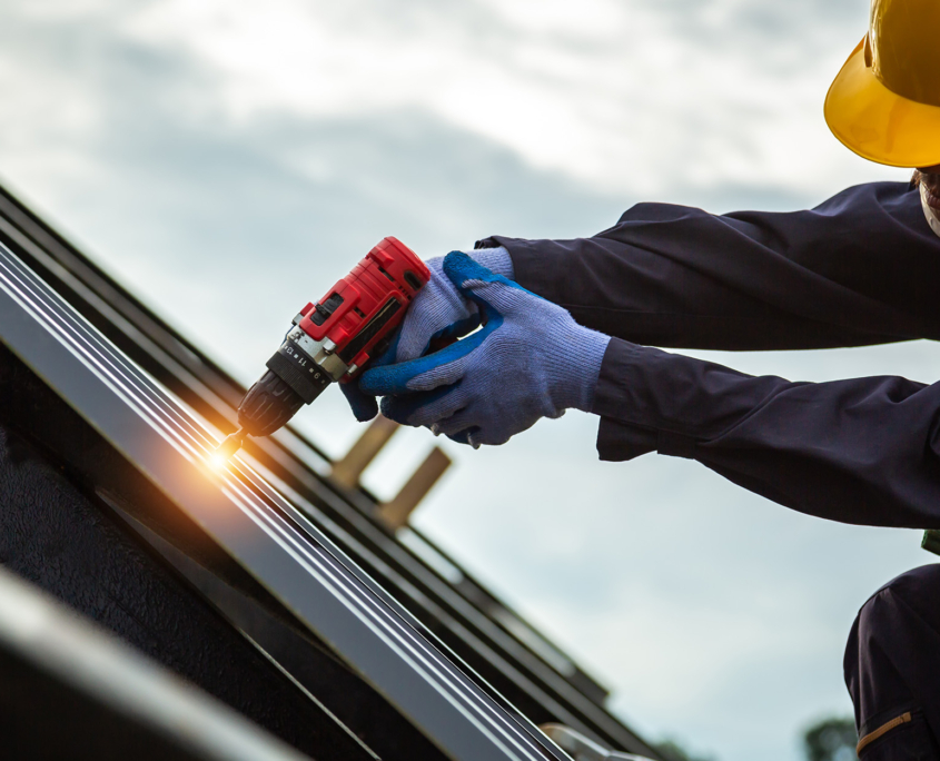 Roofer Worker In Protective Uniform Wear And Gloves